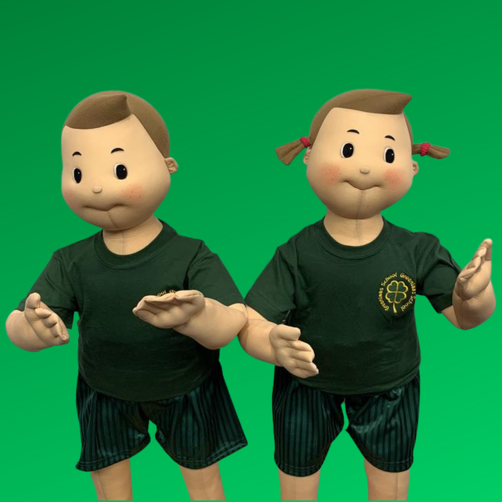 Boy and girl mannequin wearing greanleas PE t-shirt and bottle green PE shorts